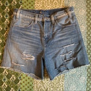 Levi’s mid to high rise distressed jean shorts